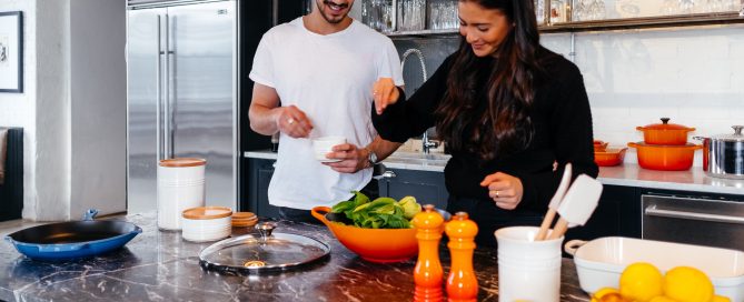 Man and woman cooking together
